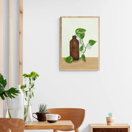 Devils Ivy in a Bottle on a Table